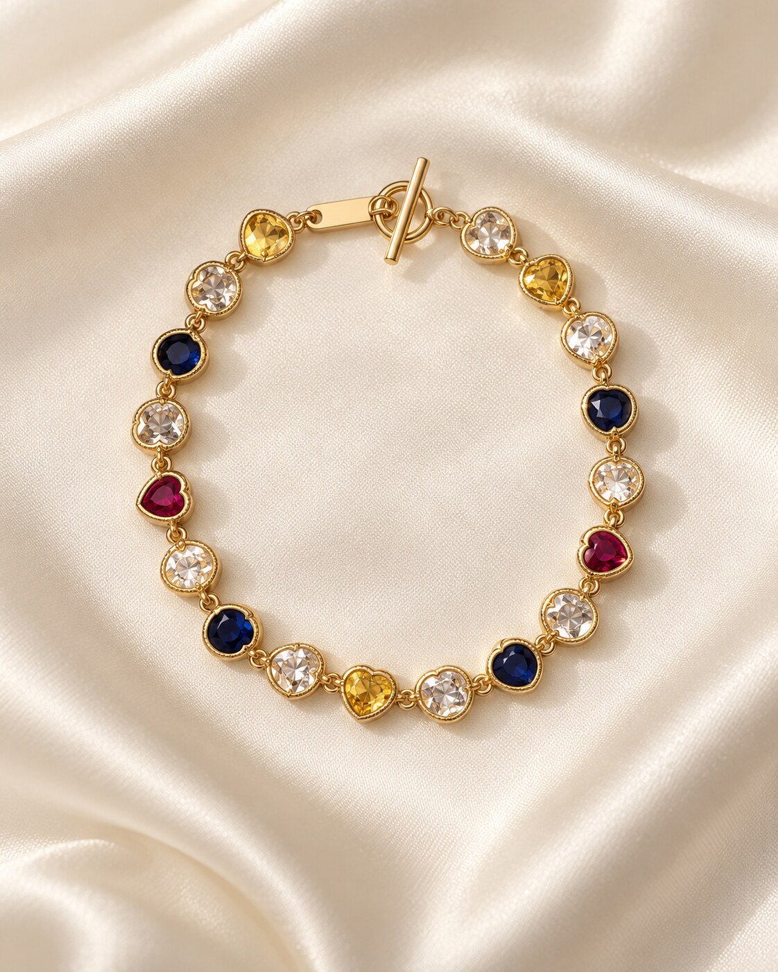 Delicate gold-tone bracelet with colourful heart-shaped stones